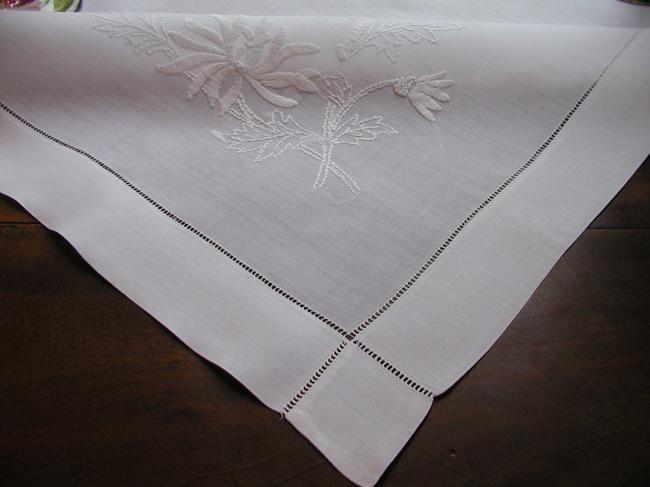 So lovely irish linen tablecloth with large embroidered knapweed flowers