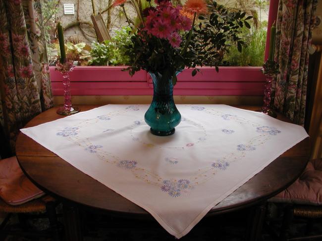 Lovely tablecloth with floral embroidery in blue colors