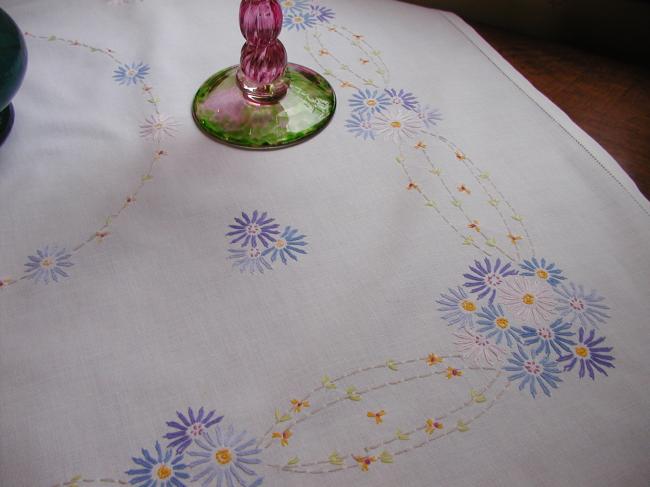 Lovely tablecloth with floral embroidery in blue colors