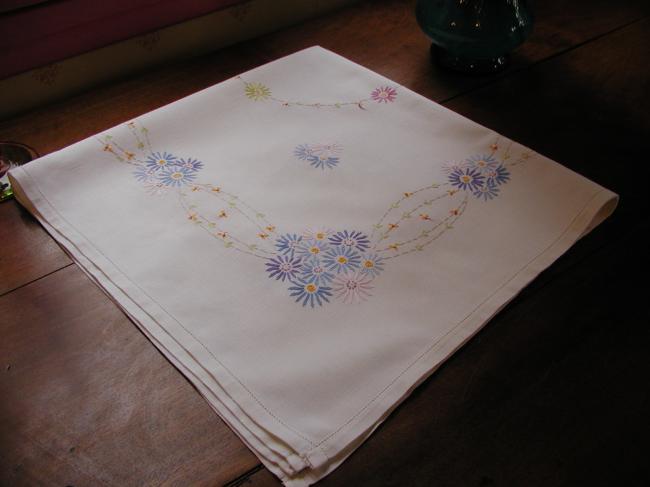 Lovely tablecloth with floral embroidery in blue colors