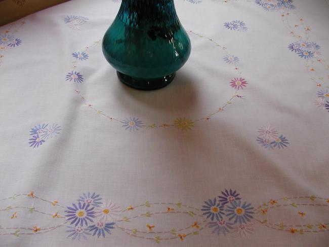 Lovely tablecloth with floral embroidery in blue colors