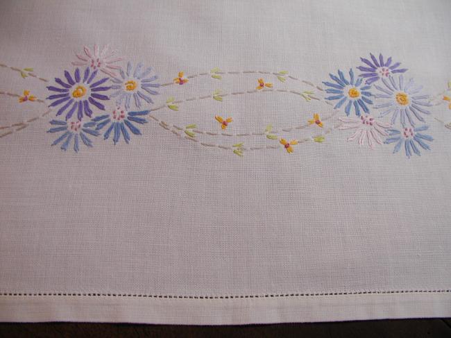 Lovely tablecloth with floral embroidery in blue colors