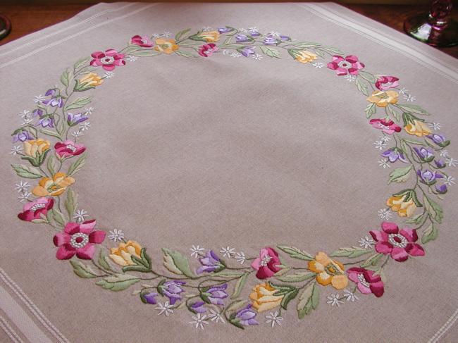 Very attractive tablecloth with a lovely hand made embroidered crown of flowers