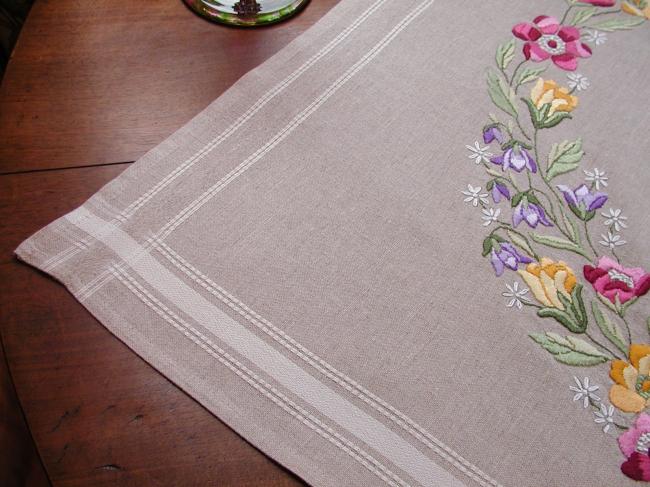 Very attractive tablecloth with a lovely hand made embroidered crown of flowers