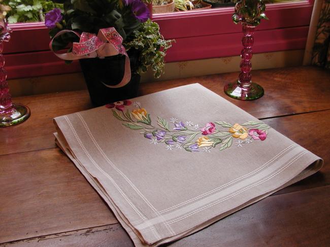 Very attractive tablecloth with a lovely hand made embroidered crown of flowers