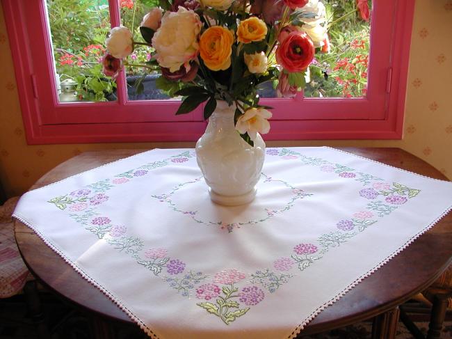 Breathtaking tablecloth with hand-embroidered  bouquets of verbena flowers