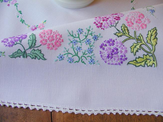 Breathtaking tablecloth with hand-embroidered  bouquets of verbena flowers