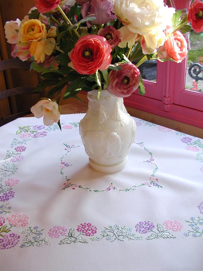 Breathtaking tablecloth with hand-embroidered  bouquets of verbena flowers