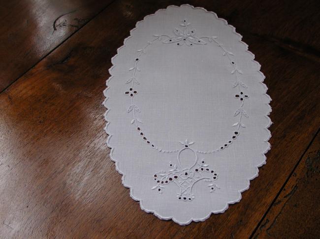 So charming oval doily with an embroidered butterfly and basket of flowers