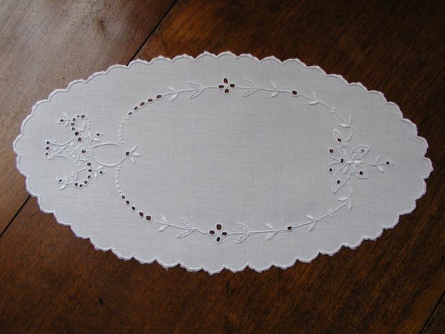 So charming oval doily with an embroidered butterfly and basket of flowers