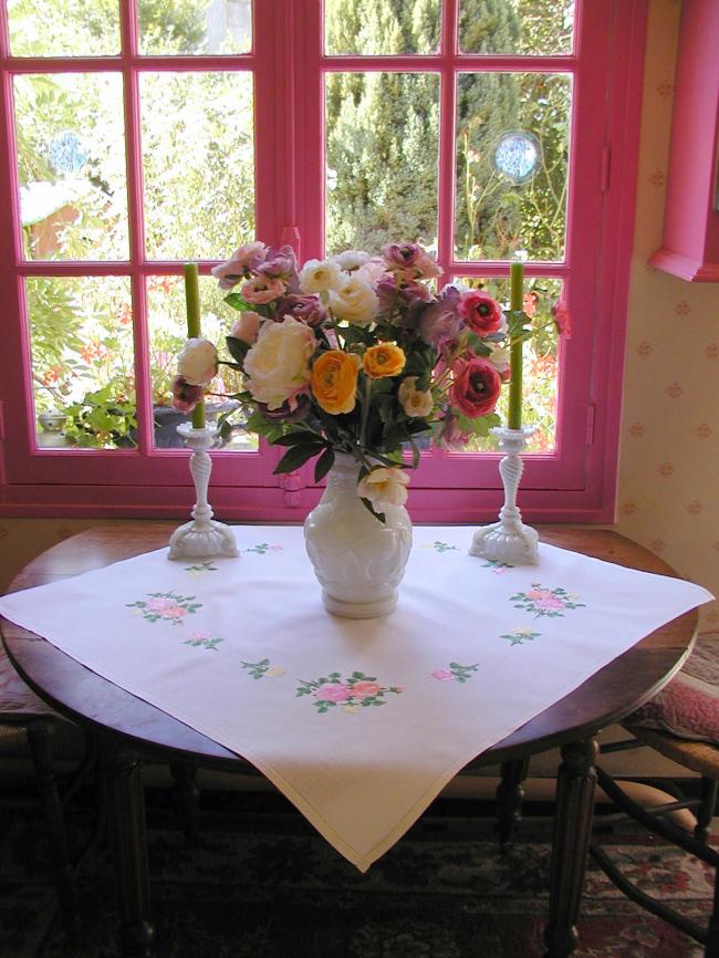 Sweet  tablecloth with hand-embroidered red, orange and pink roses