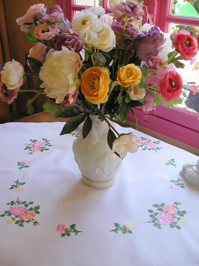 Sweet  tablecloth with hand-embroidered red, orange and pink roses