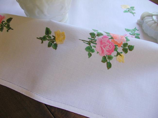 Sweet  tablecloth with hand-embroidered red, orange and pink roses