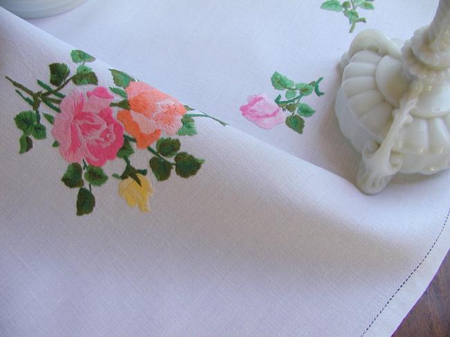 Sweet  tablecloth with hand-embroidered red, orange and pink roses