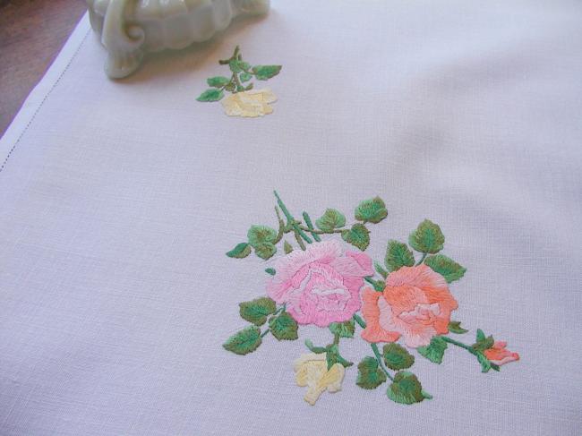 Sweet  tablecloth with hand-embroidered red, orange and pink roses