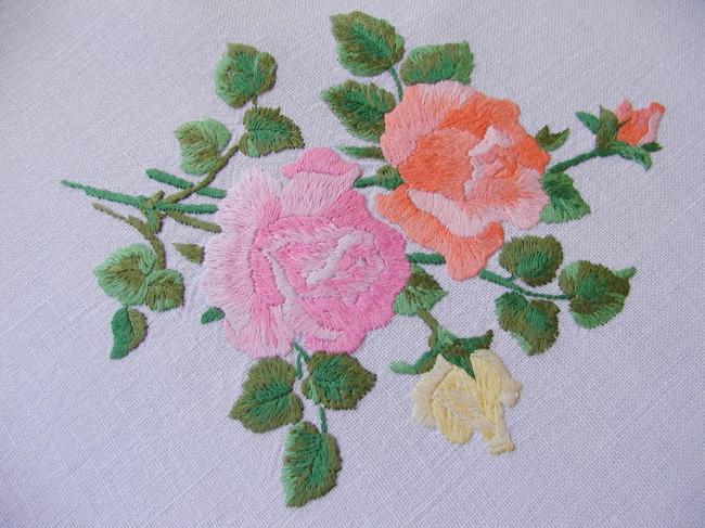 Sweet  tablecloth with hand-embroidered red, orange and pink roses