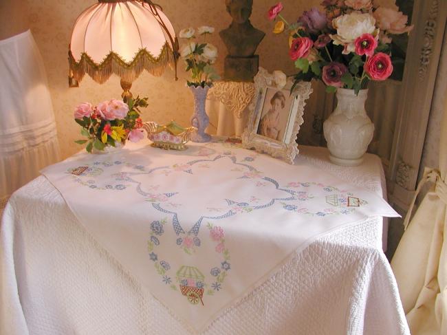 Lovely tablecloth with hand-embroidered flowers and little carriages