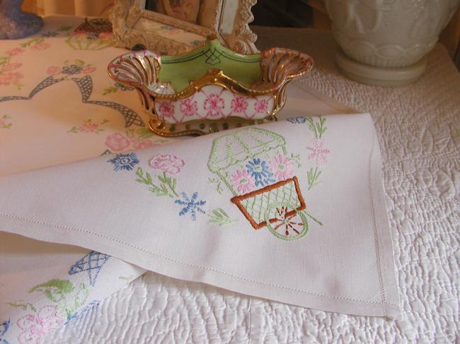 Lovely tablecloth with hand-embroidered flowers and little carriages