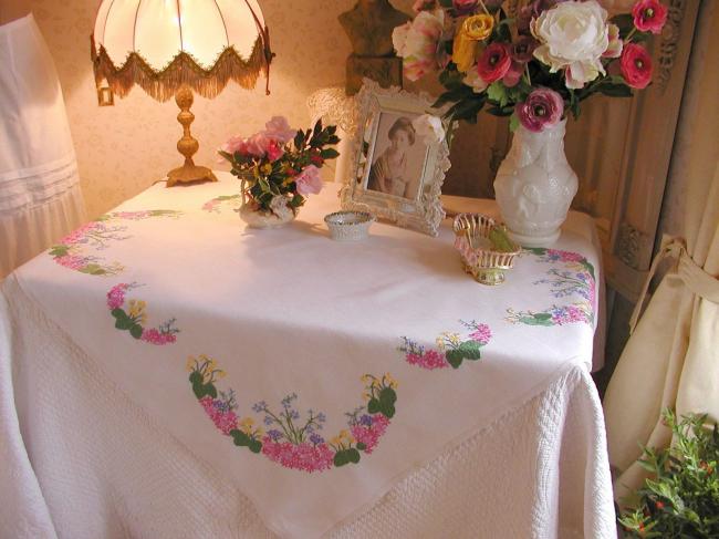 Sweet spring tablecloth with embroidered flowers like blue bells,primula, etc..