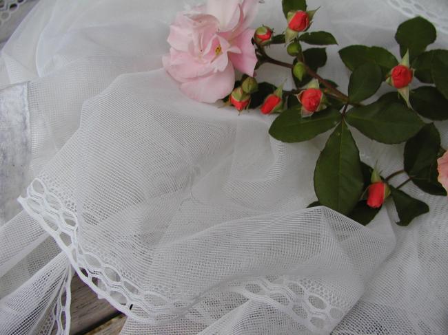 Lovely pair of net curtain, with floral pattern, ready to be hanged