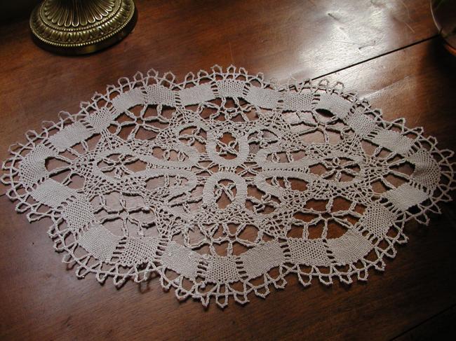 Lovely oval bobbin Cluny lace doily 1920