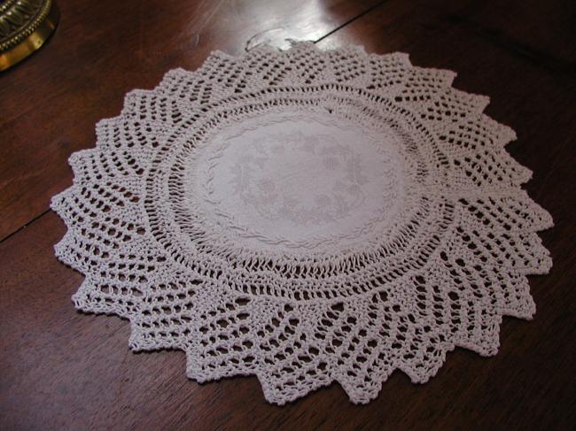 Charming knitted lace doily with damask linen with holly tree leaves