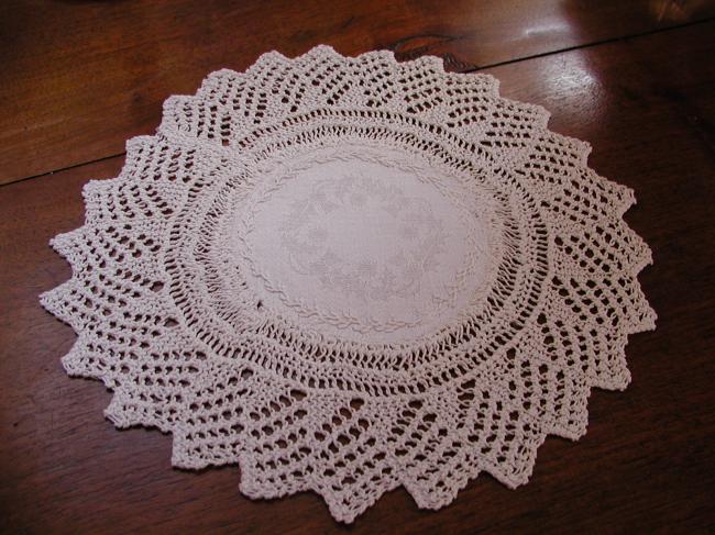 Charming knitted lace doily with damask linen with holly tree leaves