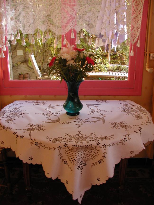 Exceptionel tablecloth in Madeira embroidery with urns,birds, blooming appletree