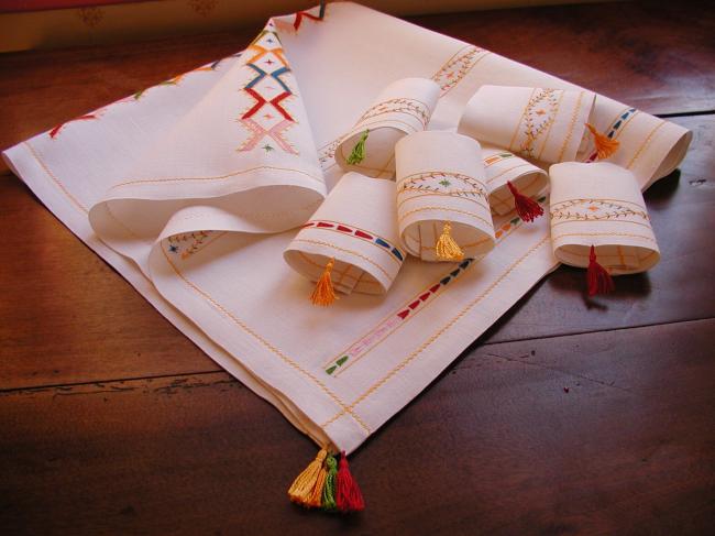 So beautiful tea tablecloth with its 6 matching napkins,colourful cross stitches