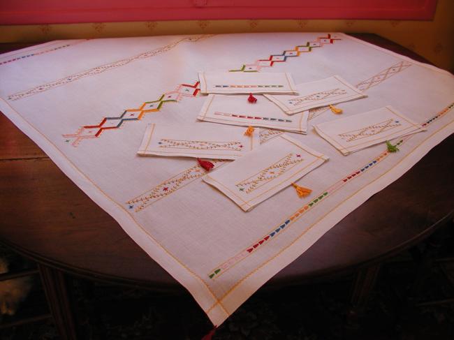 So beautiful tea tablecloth with its 6 matching napkins,colourful cross stitches