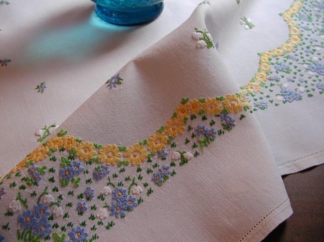 Striking tablecloth with hand-embroidered spring flowers