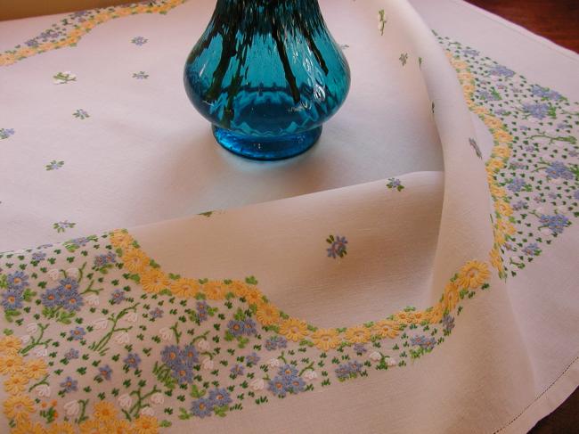 Striking tablecloth with hand-embroidered spring flowers