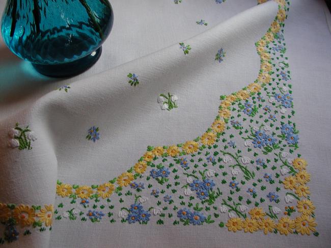 Striking tablecloth with hand-embroidered spring flowers