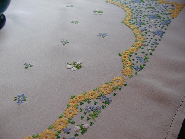 Striking tablecloth with hand-embroidered spring flowers