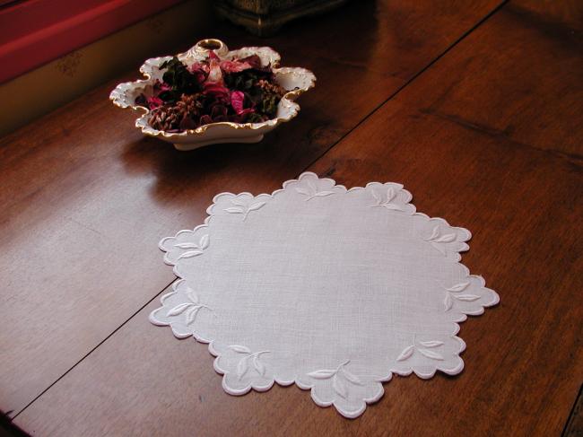 So charming round doily with scalopped edging and embroidered foliage