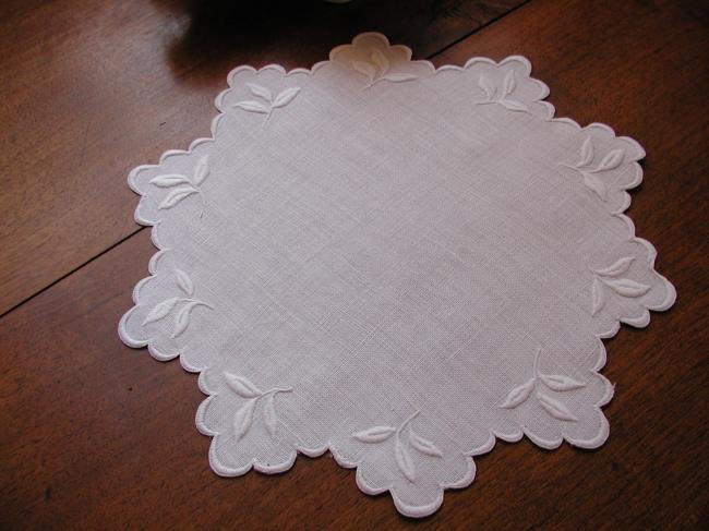 So charming round doily with scalopped edging and embroidered foliage