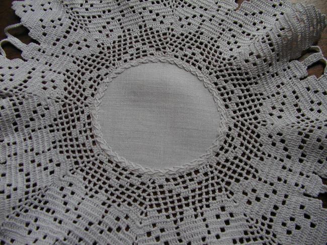 Stunning round doily with crochet lace depicting butterflies