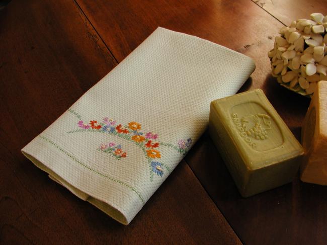 Lovely green hand towel with embroidered flowers