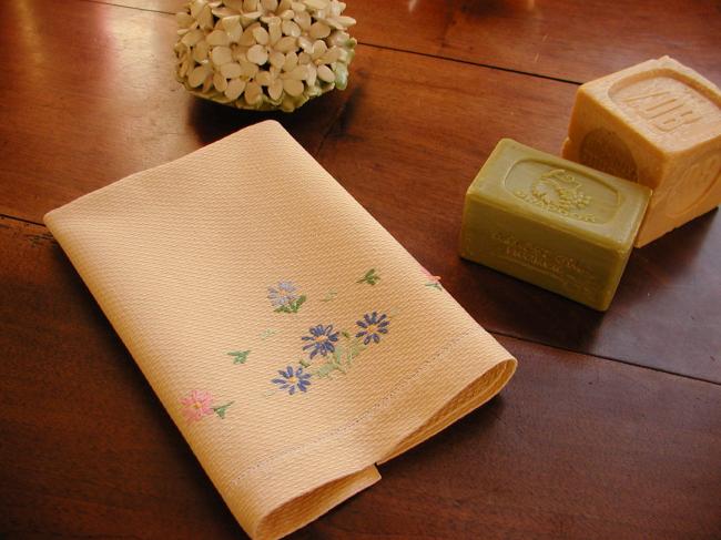 Lovely yellow waffle hand towel with embroidered flowers