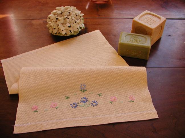 Lovely yellow waffle hand towel with embroidered flowers