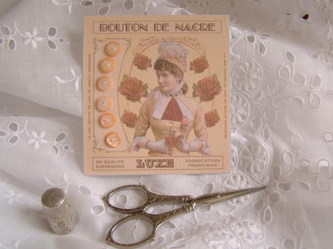 Lovely card with 6 antique engraved buttons in mother of pearl, peach color