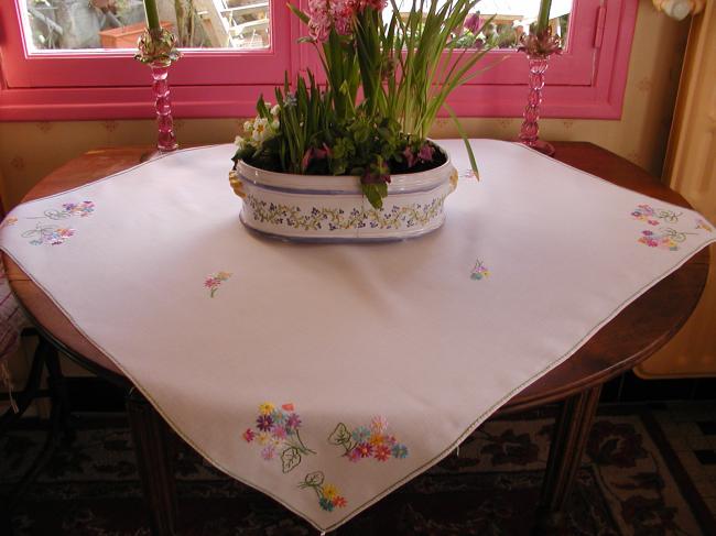 Sweet tablecloth with hand-embroidered small bouquets of flowers