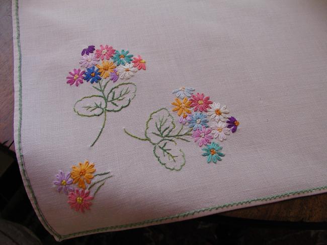 Sweet tablecloth with hand-embroidered small bouquets of flowers