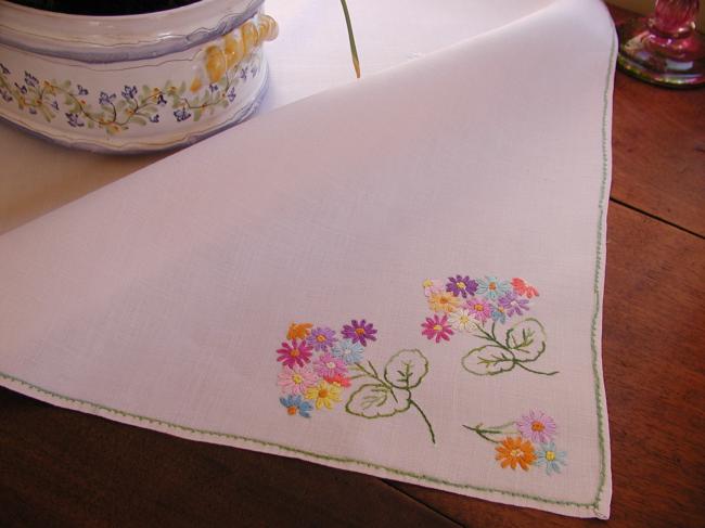 Sweet tablecloth with hand-embroidered small bouquets of flowers