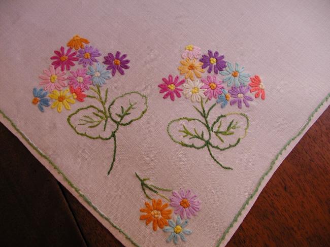 Sweet tablecloth with hand-embroidered small bouquets of flowers