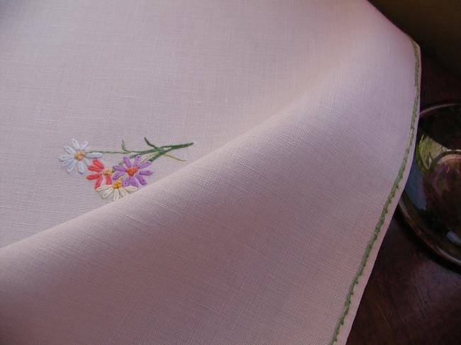 Sweet tablecloth with hand-embroidered small bouquets of flowers