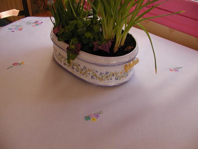 Sweet tablecloth with hand-embroidered small bouquets of flowers