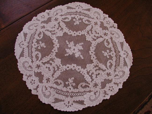 Stunning doily in net lace with needle run embroidered flowers 1900