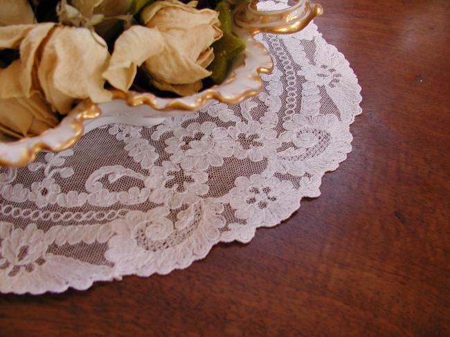 Stunning doily in net lace with needle run embroidered flowers 1900