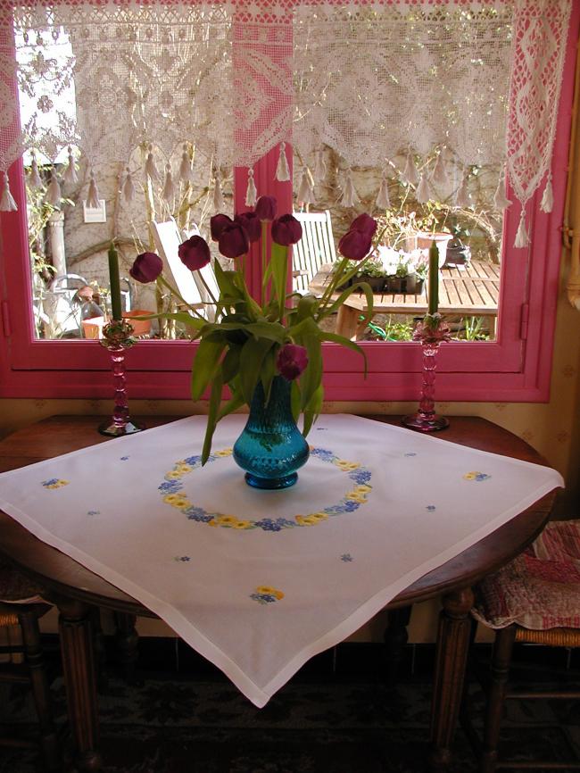 Lovely tablecloth with hand-embroidered crown of yellow and blue flowers